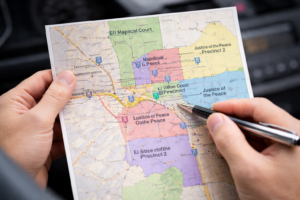 Driver reviewing court jurisdiction map for El Paso speeding ticket dismissal